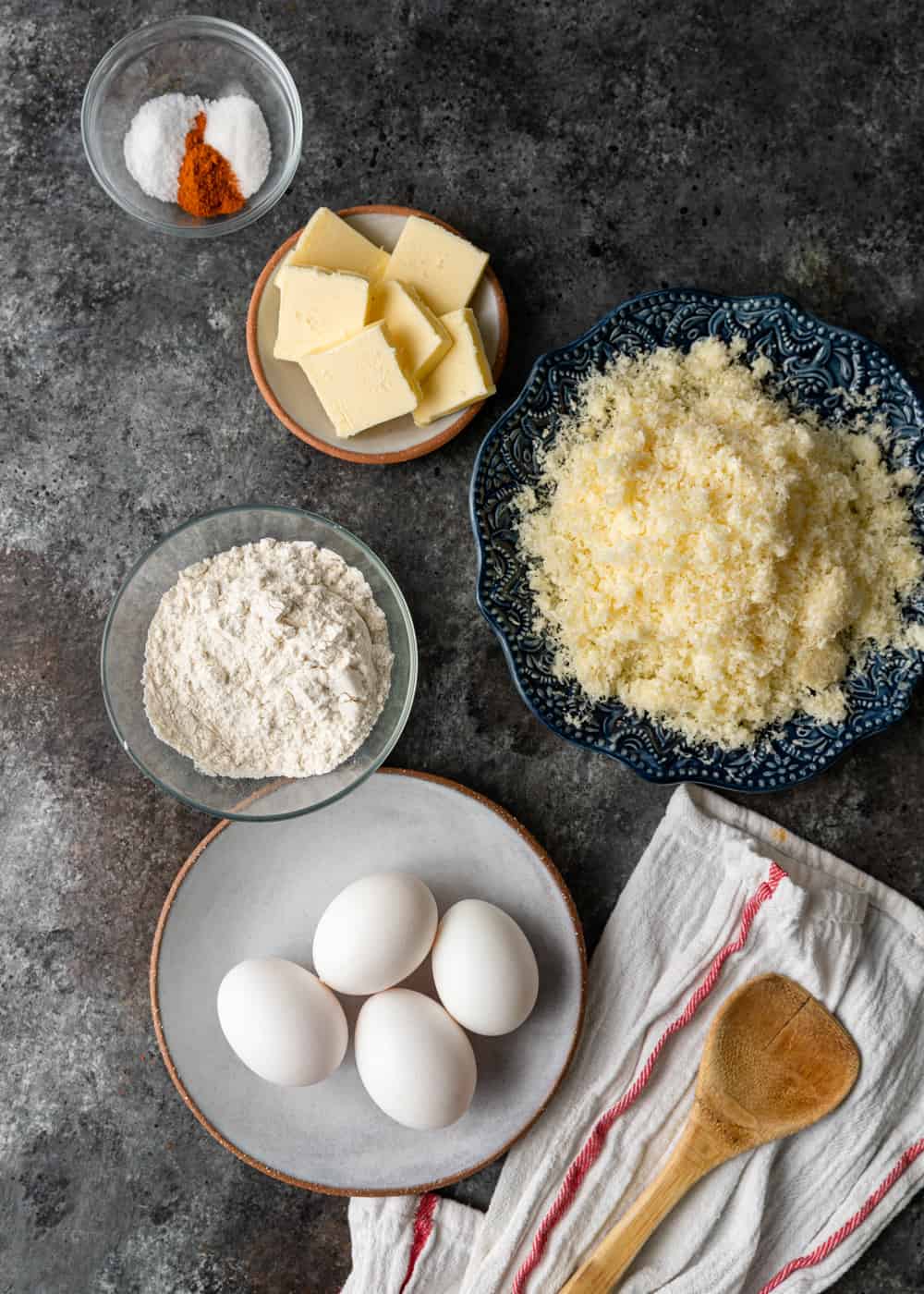 eggs, butter, flour and other ingredients to make choux pastry recipe for cheesy appetizers called gougeres
