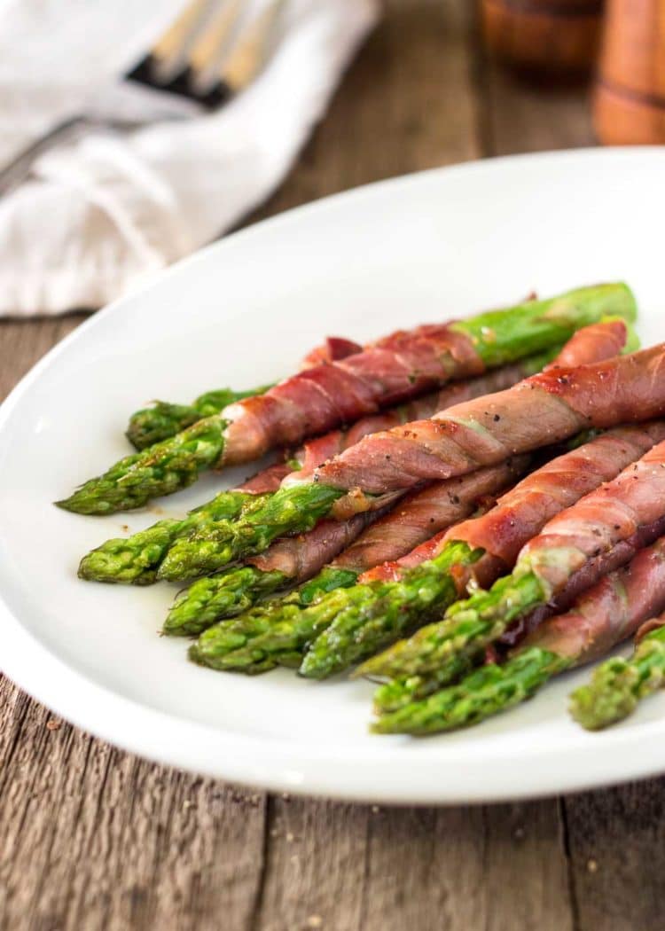 Savory, salty, and crispy, these Asparagus Wrapped in Prosciutto and Sage are such a perfect side dish that can also double as an appetizer. www.keviniscooking.com