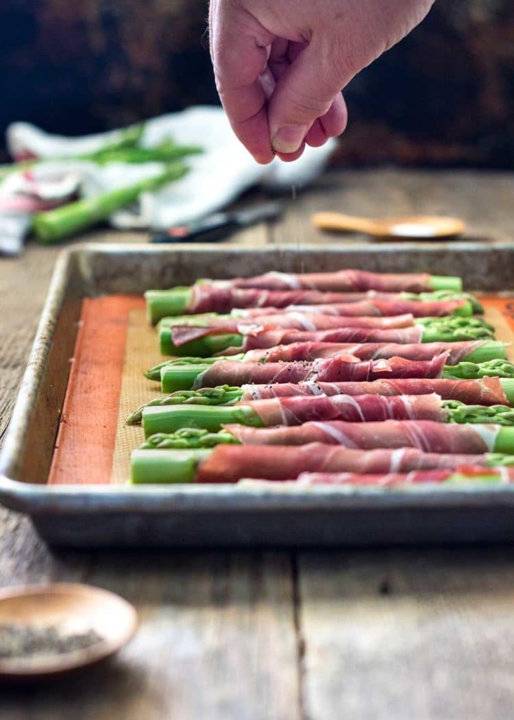 Savory, salty, and crispy, these Asparagus Wrapped in Prosciutto and Sage are such a perfect side dish that can also double as an appetizer. www.keviniscooking.com