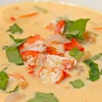 crab coconut soup with chopped basil