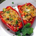 A plate of food, with Chorizo stuffed Peppers