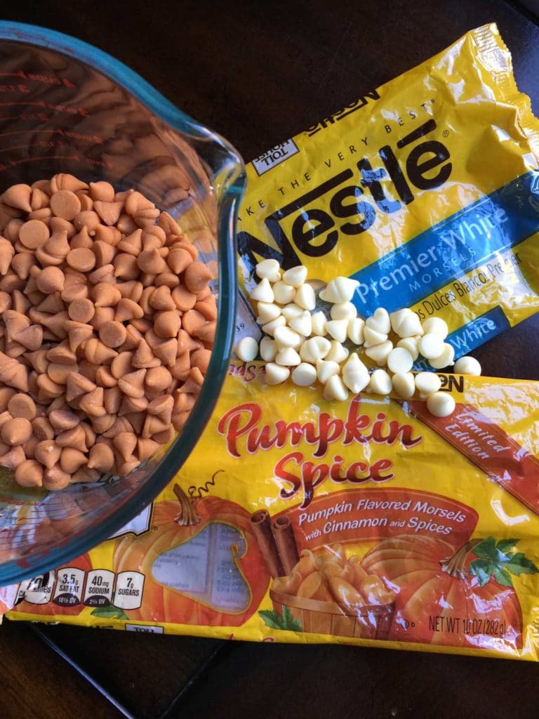 open packages of white chocolate chips and pumpkin spice chips