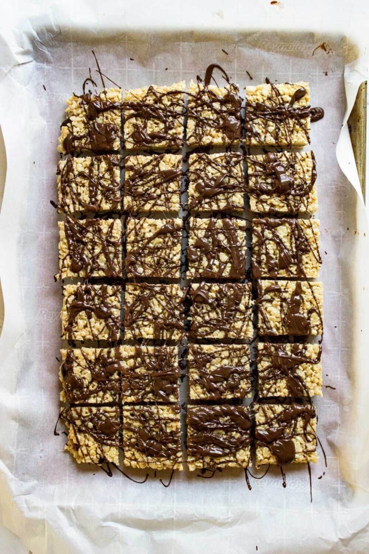 These Chocolate Cinnamon Rice Krispie Squares are ridiculously delicious and addictive. 2 layers of Rice Krispie treats with melted chocolate inside and on top! www.keviniscooking.com