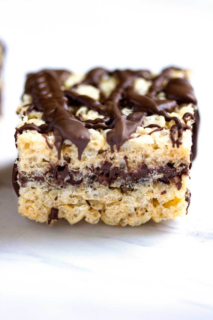 These Chocolate Cinnamon Rice Krispie Squares are ridiculously delicious and addictive. 2 layers of Rice Krispie treats with melted chocolate inside and on top! www.keviniscooking.com