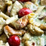 Tender browned chicken, smothered in a creamy pesto sauce with pasta and tomatoes. A delicious Italian inspired meal that can feed a crowd. Easily double it for more than 4, the family loves it! www.keviniscooking.com