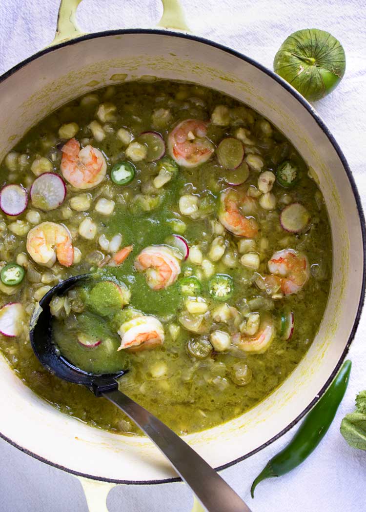 overhead: green soup with shrimp in large pot