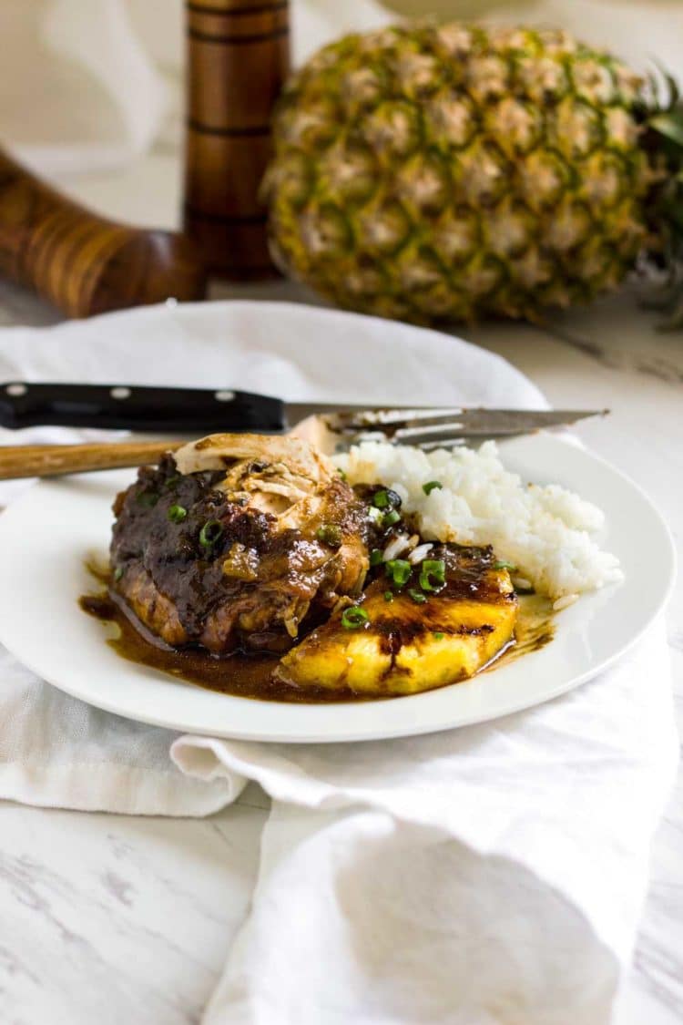 With Caribbean influences this Tropical Pineapple Chicken recipe uses a marinade turn glaze, reminiscent of a jerk sauce. Grilled or baked recipe versions! www.keviniscooking.com
