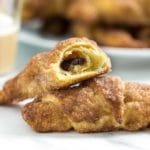 These super easy breakfast or dessert hand held Cinnamon Glazed Chocolate Crescents are made with refrigerated dough, chocolate chips and rolled in cinnamon sugar. These go quick and are a house favorite! www.keviniscooking.com