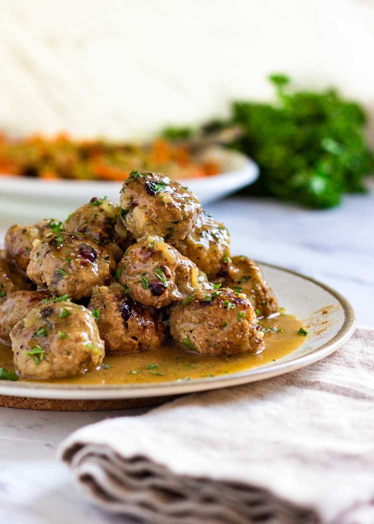 Super moist, tender and packed with flavor, these Cranberry Turkey Meatballs are great any time of year! A quick pan sauce coats them, easily serve as an appetizer or with a side for a meal. Not dried out lumps, these meatballs are beyond and a family favorite! www.keviniscooking.com