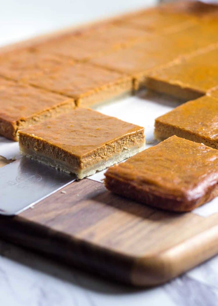 Slab pies come with all the goodness of a slice of pie, but in bar form. These Pumpkin Pie Bars are made right in the sheet pan and easily cut up for a hand held dessert bite. www.keviniscooking.com