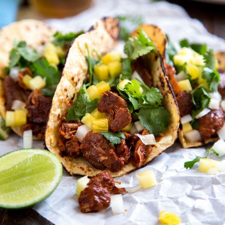 My Tacos Al Pastor version is done in the kitchen with marinated pork flavored with various chiles, pineapple, onion, garlic and cinnamon. With 2 cooking methods you can make this instead of carnitas tonight! keviniscooking.com