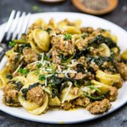 A close up of a plate of food with broccoli, with Orecchiette and Sausage