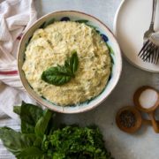 overhead: bowl of creamy Instant Pot polenta topped with parmesan cheese
