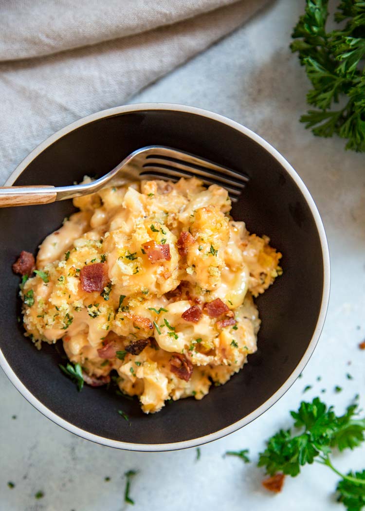 My Bacon Mac and Cheese Casserole is loaded with crisp bacon, cheddar, mozzarella and cream cheese. Topped with buttery Panko breadcrumbs. Pasta perfection! keviniscooking.com