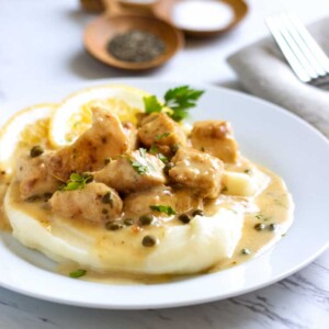 No pounding out thin chicken pieces. This Chopped Chicken Piccata is served in a rich, lemony caper sauce over mashed potatoes. Easy, tasty comfort food! keviniscooking.com