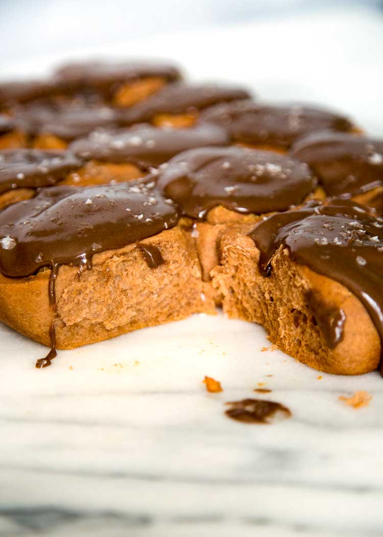 These Peanut Butter Chocolate Rolls are my spin on the classic homemade cinnamon roll. A peanut butter filling is rolled inside and a chocolate dough and is topped with a Nutella cream cheese glaze. keviniscooking.com