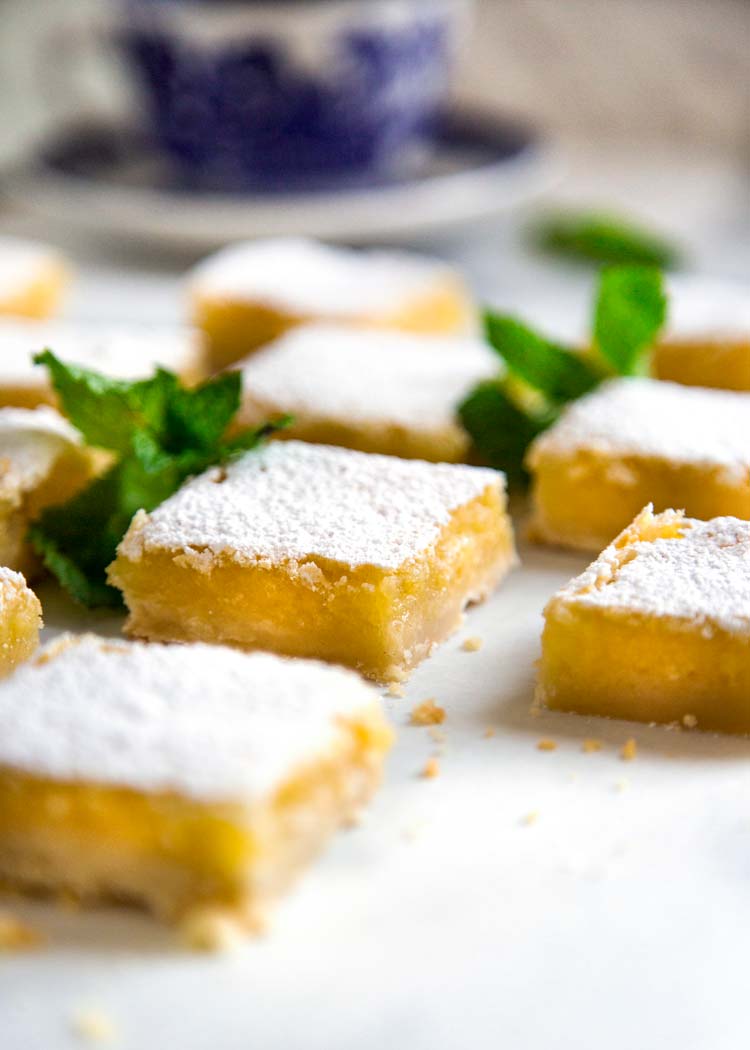 These Shortbread Lemon Bars are tart, sweet and the shortbread crust is crumbly soft. The perfect summer picnic dessert that can be enjoyed year round! keviniscooking.com
