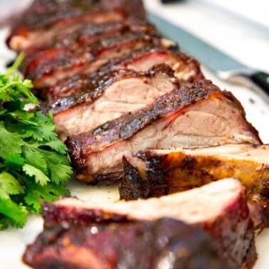 close up: jerk pork Jamaican baby back ribs, sliced