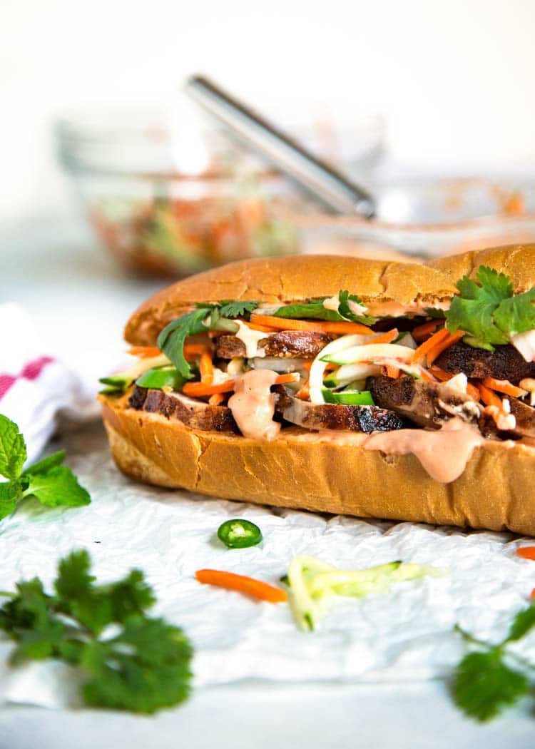 Teriyaki Pork Bahn Mi Sandwich has sliced, glazed pork tenderloin layered with pickled vegetables and herbs for a perfect lunch, party or Game Day favorite. keviniscooking.com