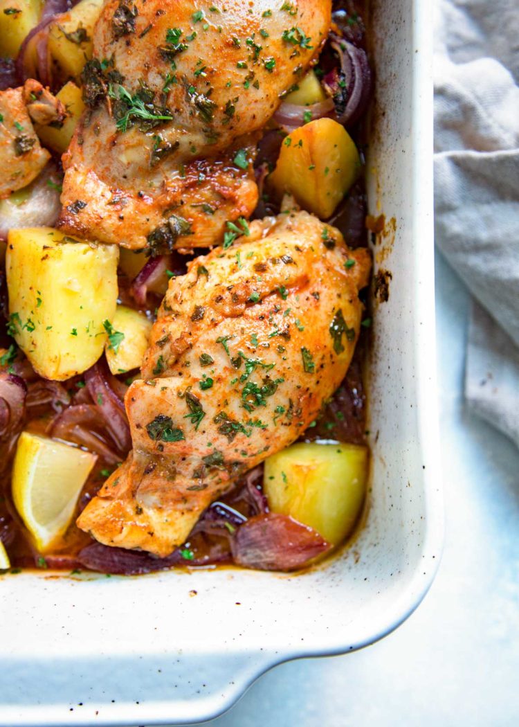This Spanish Roasted Chicken and Potatoes is a one pan, super easy mid-week dinner for the family. Chicken thighs are seasoned with smoked paprika and lemon juice, slow roasted with red onions, garlic and potatoes and sherry. 