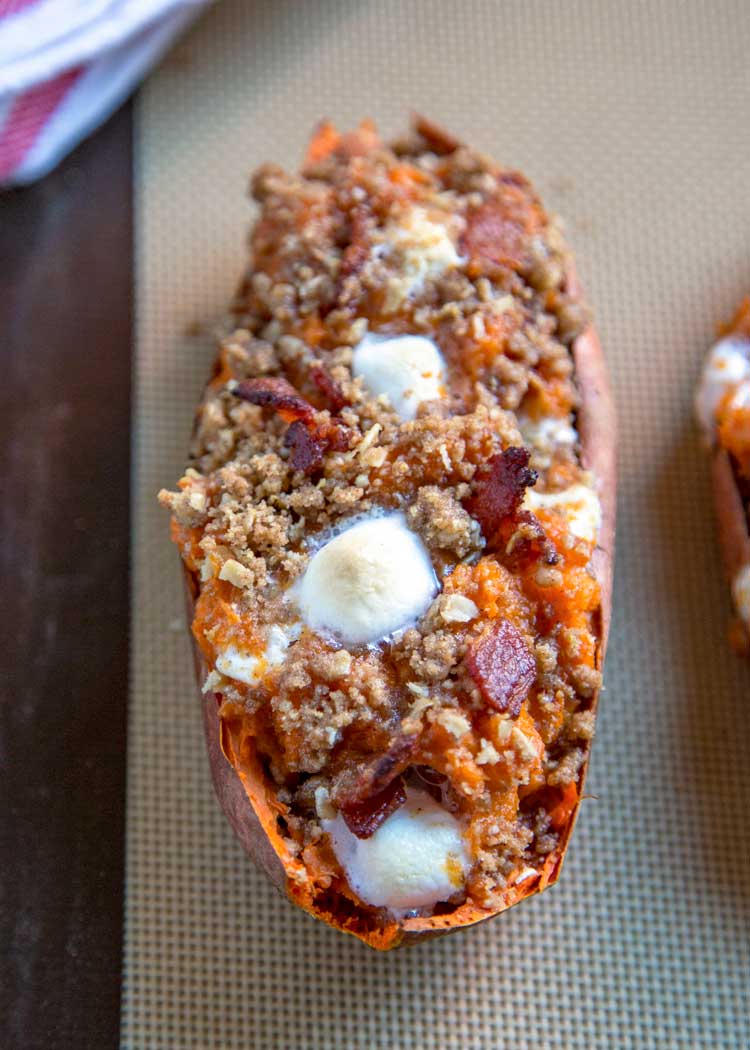 These Loaded Twice Baked Sweet Potatoes have sweet brown sugar streusel and marshmallows to savory bacon all mixed with buttery mashed sweet potato. keviniscooking.com