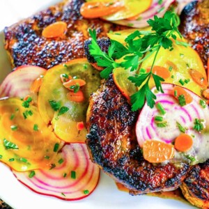Honey Turmeric Pork Cutlet with Rainbow Beet and Carrot Salad. Pounded pork cutlets get a marinade of garlic infused yogurt, honey, lemon juice and turmeric and topped with a bright, thinly sliced beet salad. keviniscooking.com