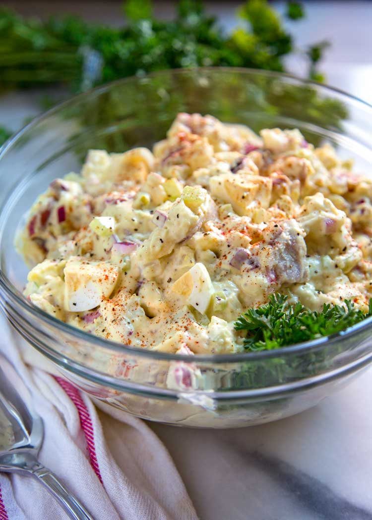 To me the classic potato salad needs to have the right balance of sweet and savory, creamy, tender yet firm potatoes, and not an overload of mayonnaise. Let me show you How to Make the Classic Potato Salad. This is your new go to version.