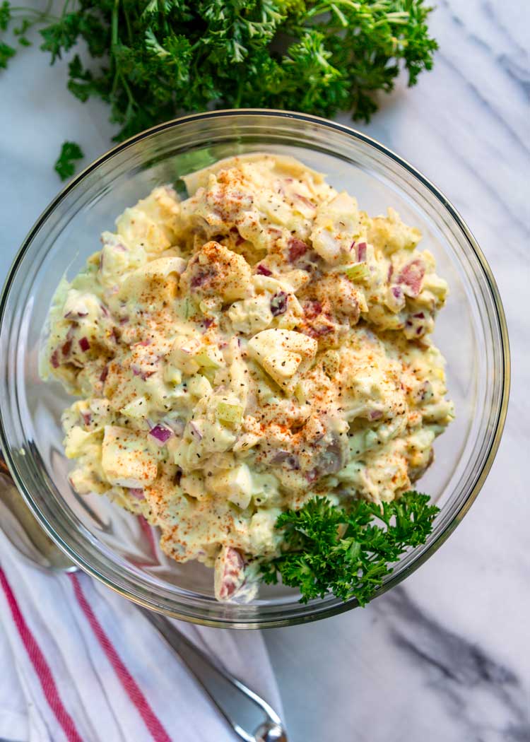 To me the classic potato salad needs to have the right balance of sweet and savory, creamy, tender yet firm potatoes, and not an overload of mayonnaise. Let me show you How to Make the Classic Potato Salad. This is your new go to version.