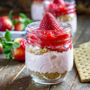 These No Bake Strawberry Cheesecake Cups are made with crushed graham crackers, cream cheese and Greek yogurt and fresh fruit. They're perfect for kids parties, the next office potluck or when that sweet tooth impulse strikes. Small, individual servings and no baking required! keviniscooking.com