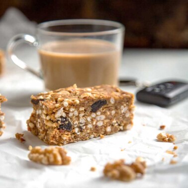 Dates, walnuts and bacon get chopped and blended with nut butter, oats and dried cherries for these no bake Savory Walnut Breakfast Bars. We often take these on hikes with the dogs and for easy snacking or whenever hunger hits.