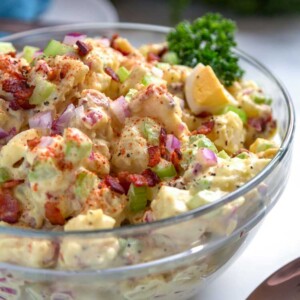Smoked Potato Salad is a must try and easy to make. Instead of boiling the potatoes I smoked them first with the usual ingredients plus bacon for the win.