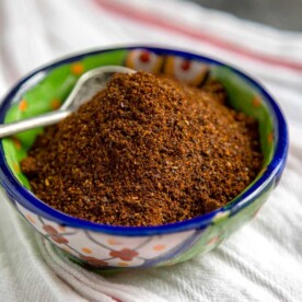 small spoon in bowl of homemade chili seasoning