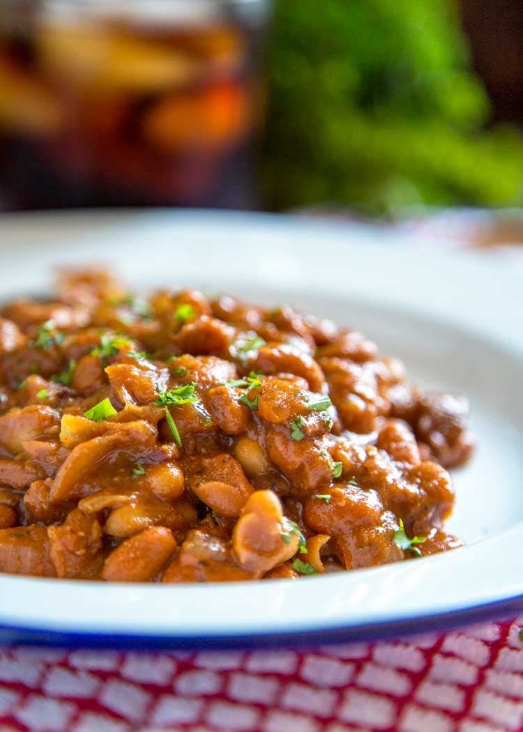 slow cooked BBQ bean side dish on white plate