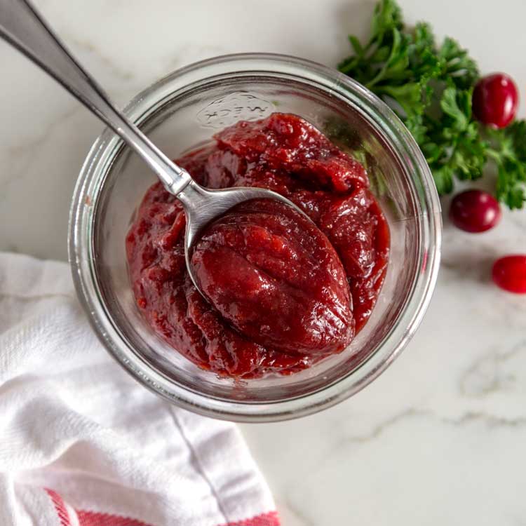 A jar and spoon in Cranberry butter