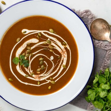 A bowl of Chipotle Pumpkin soup with crema drizzle
