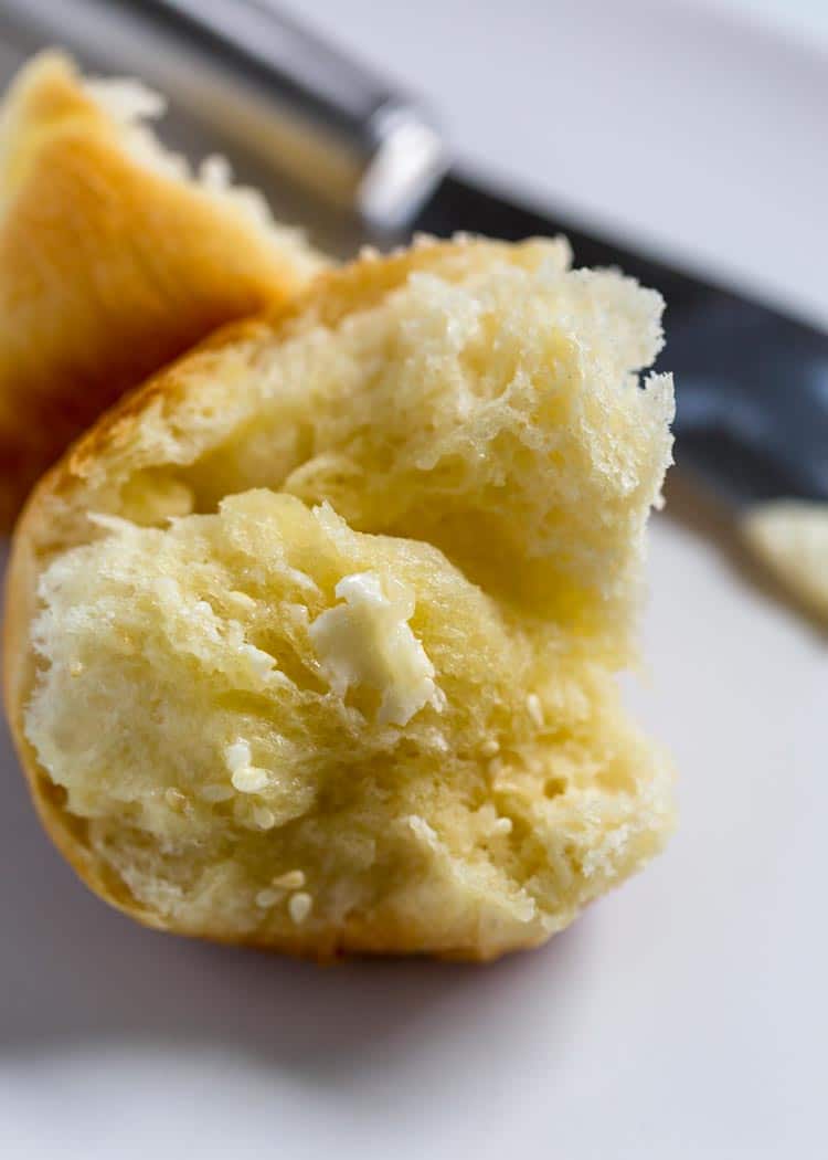 close up of a Gramma's Potato Rolls with melted butter