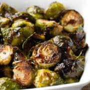 close up shot: roasted brussel sprouts covered in balsamic glaze