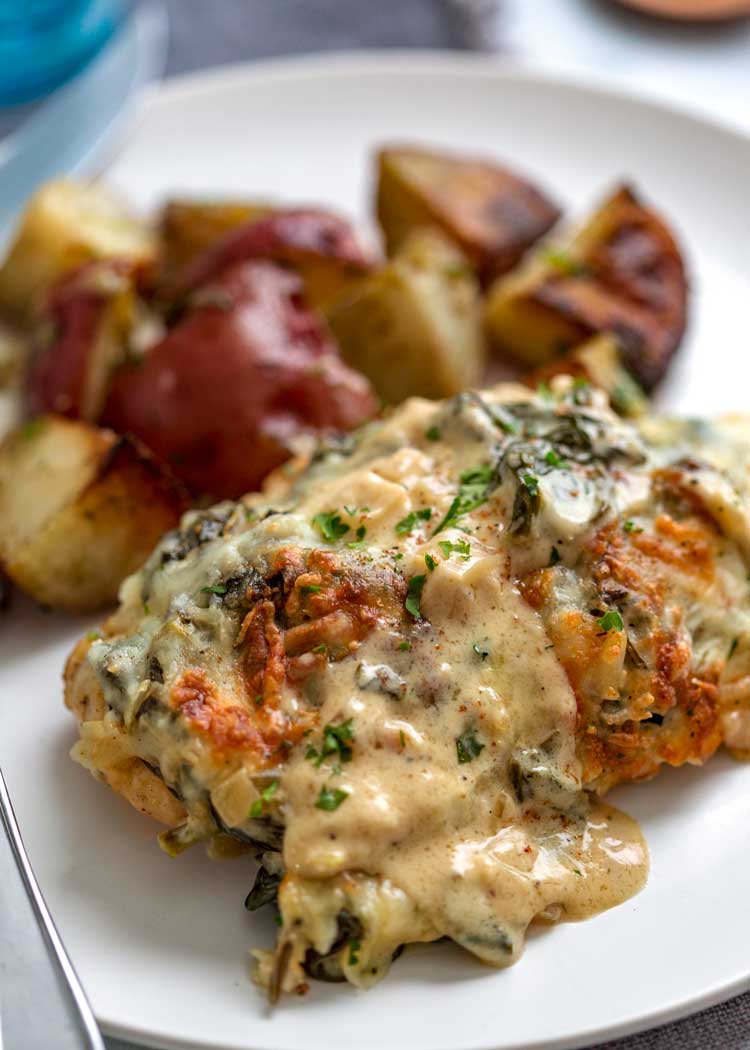 plate of Creamy Chicken Florentine with roasted potatoes