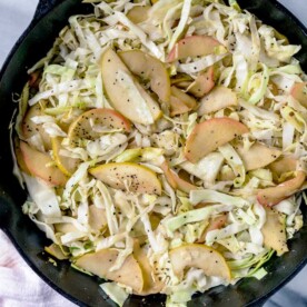 braised cabbage and apple in white casserole dish