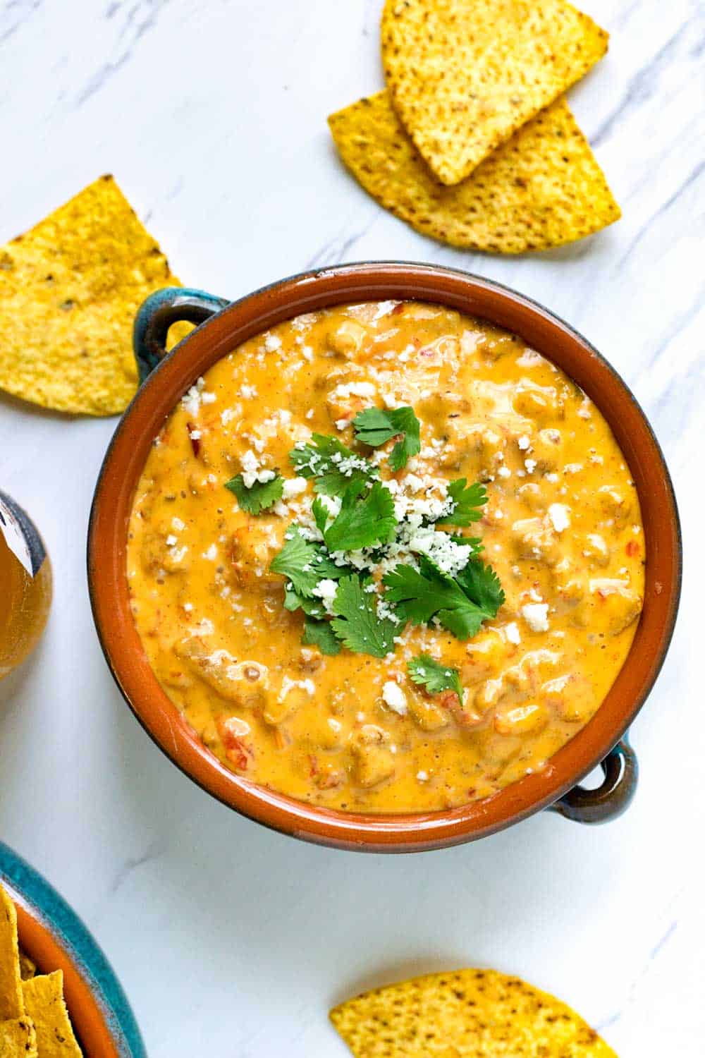 Bowl of spicy Mexican warm cheese appetizer made with beef