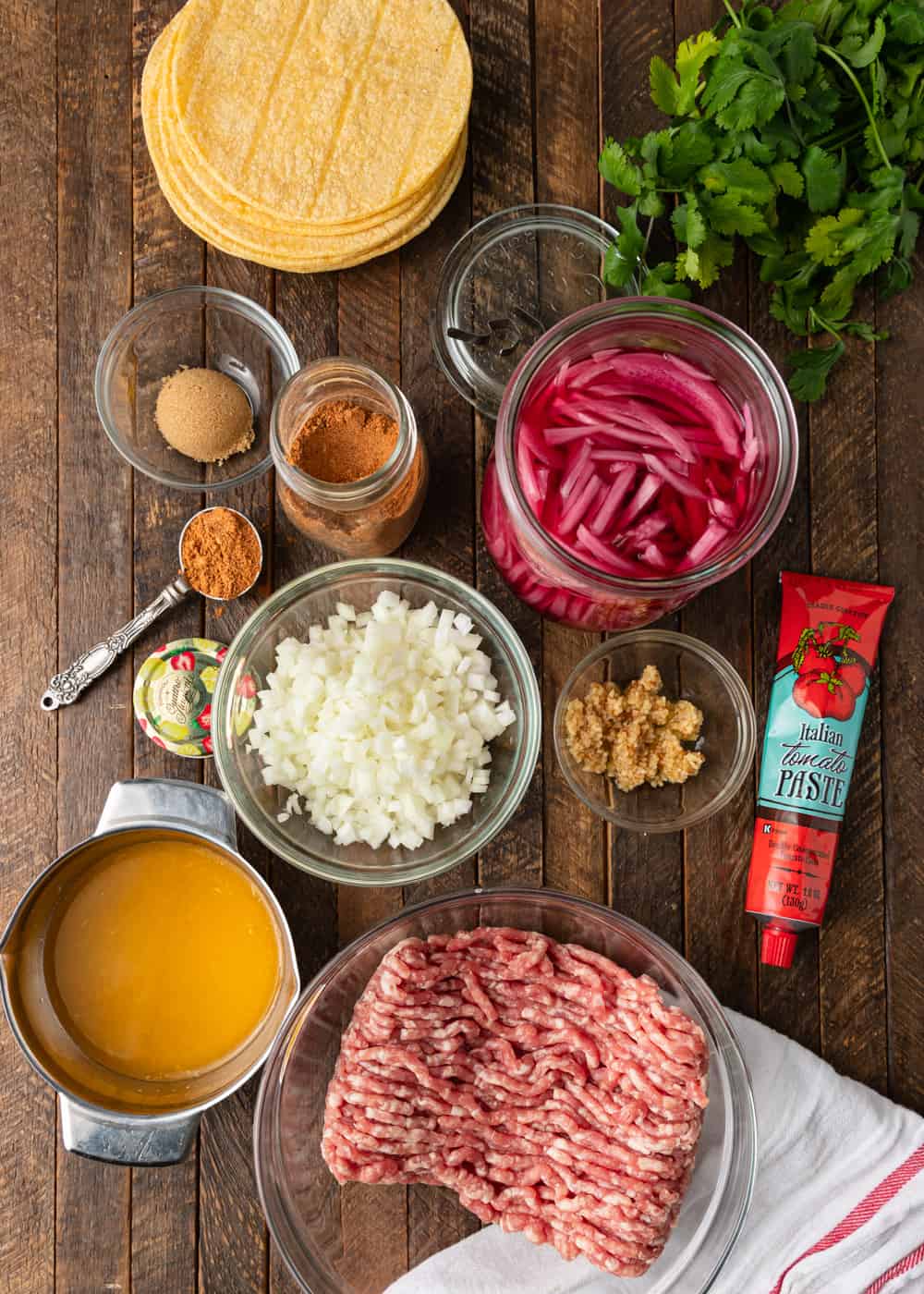 ingredients in prep bowls to make a ground pork taco recipe