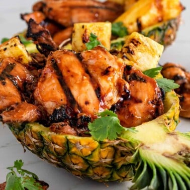 Hawaiian BBQ chicken in a pineapple boat serving dish