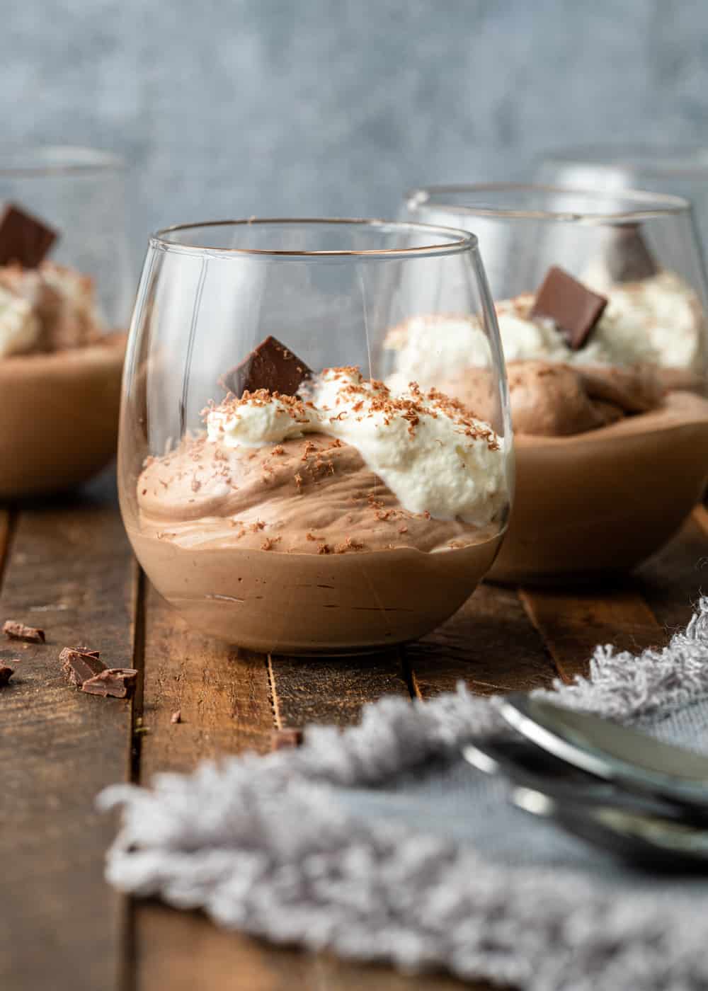 A glass bowl on a table, with Chocolate and Mousse