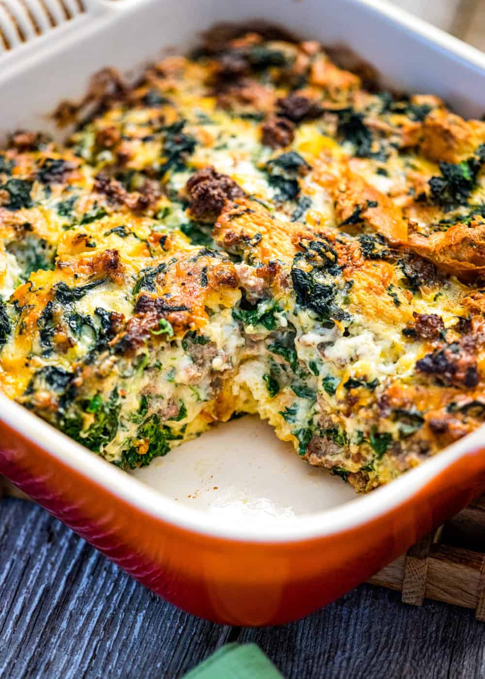 holiday breakfast casserole in red baking dish