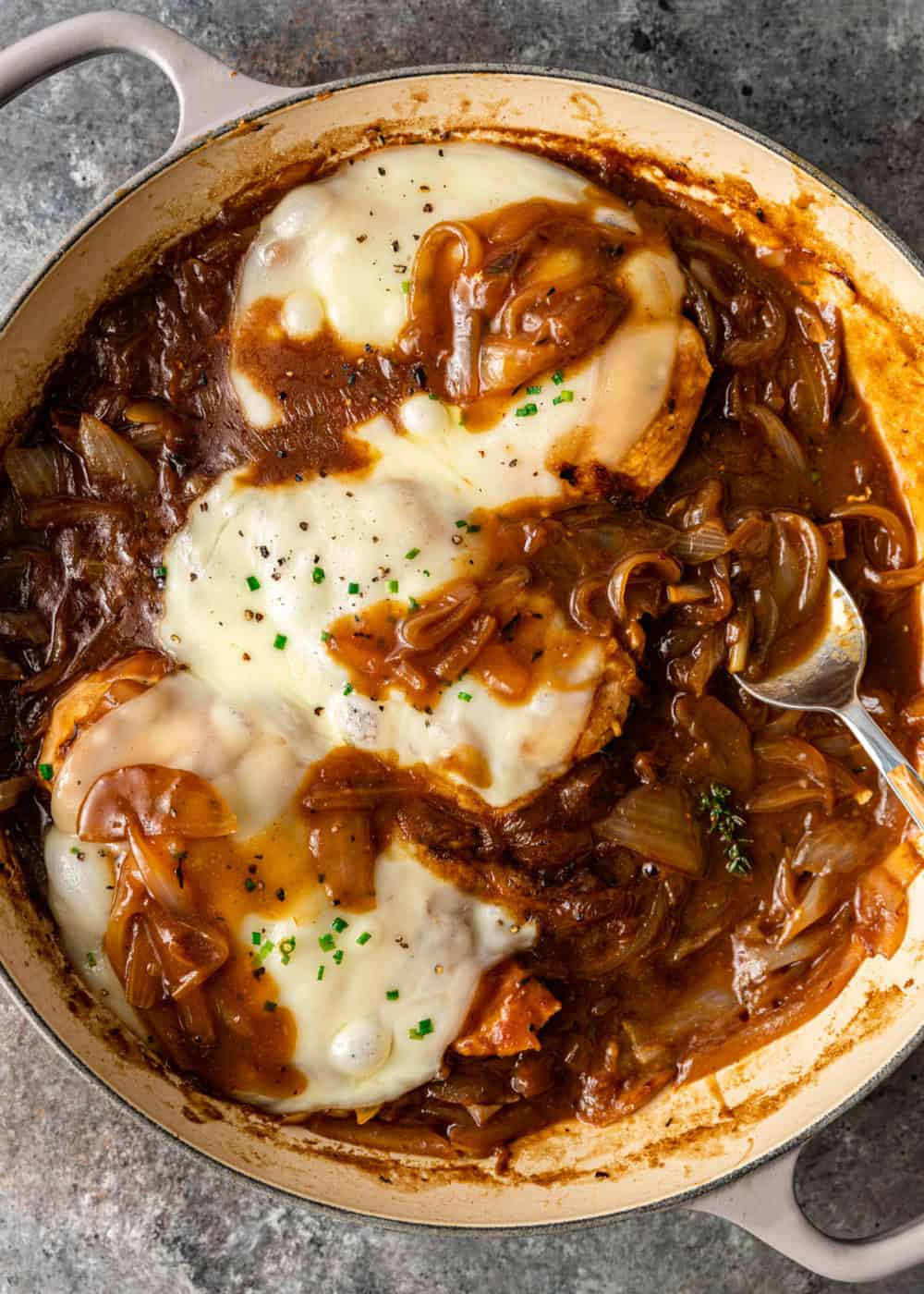 chicken with french onions and sauce in a pot