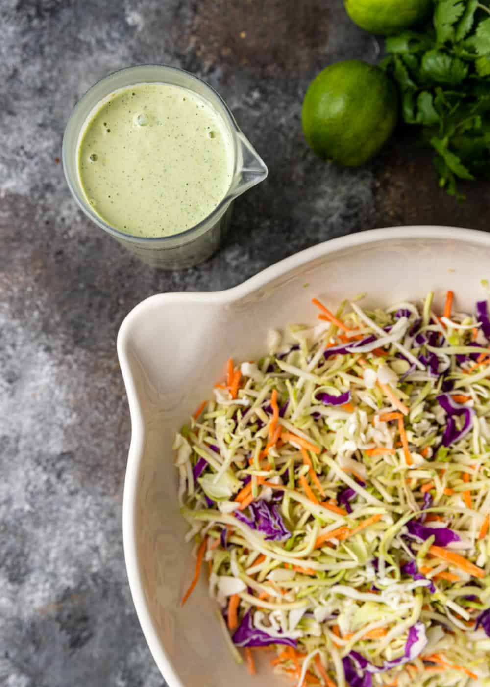 overhead: creamy cilantro lime dressing and salad mixture to make spicy coleslaw recipe