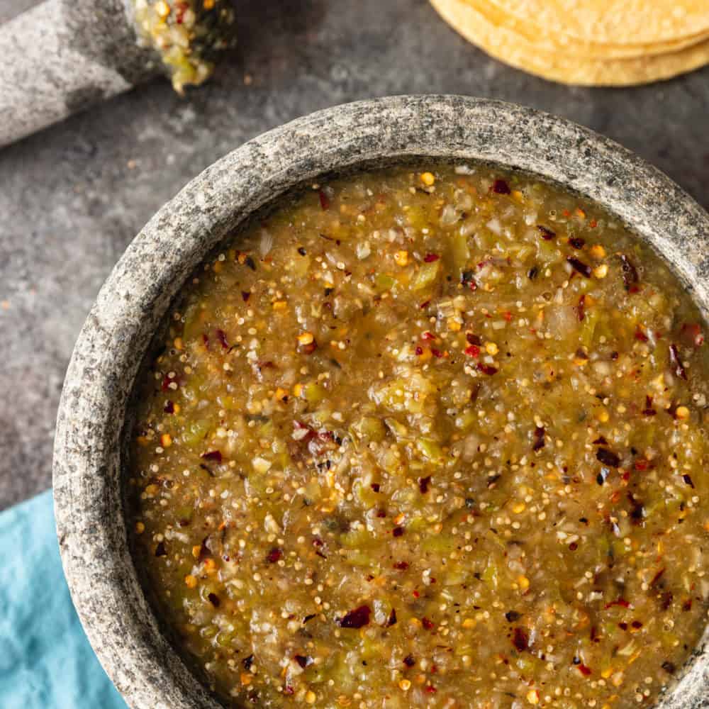 overhead: spicy Mexican sauce in gray serving bowl