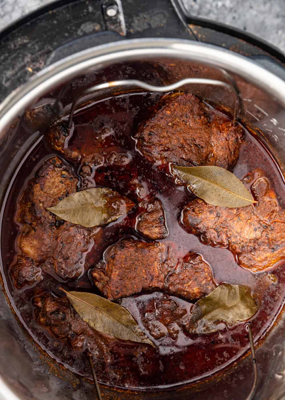 overhead: instant pot barbacoa cooking in pot