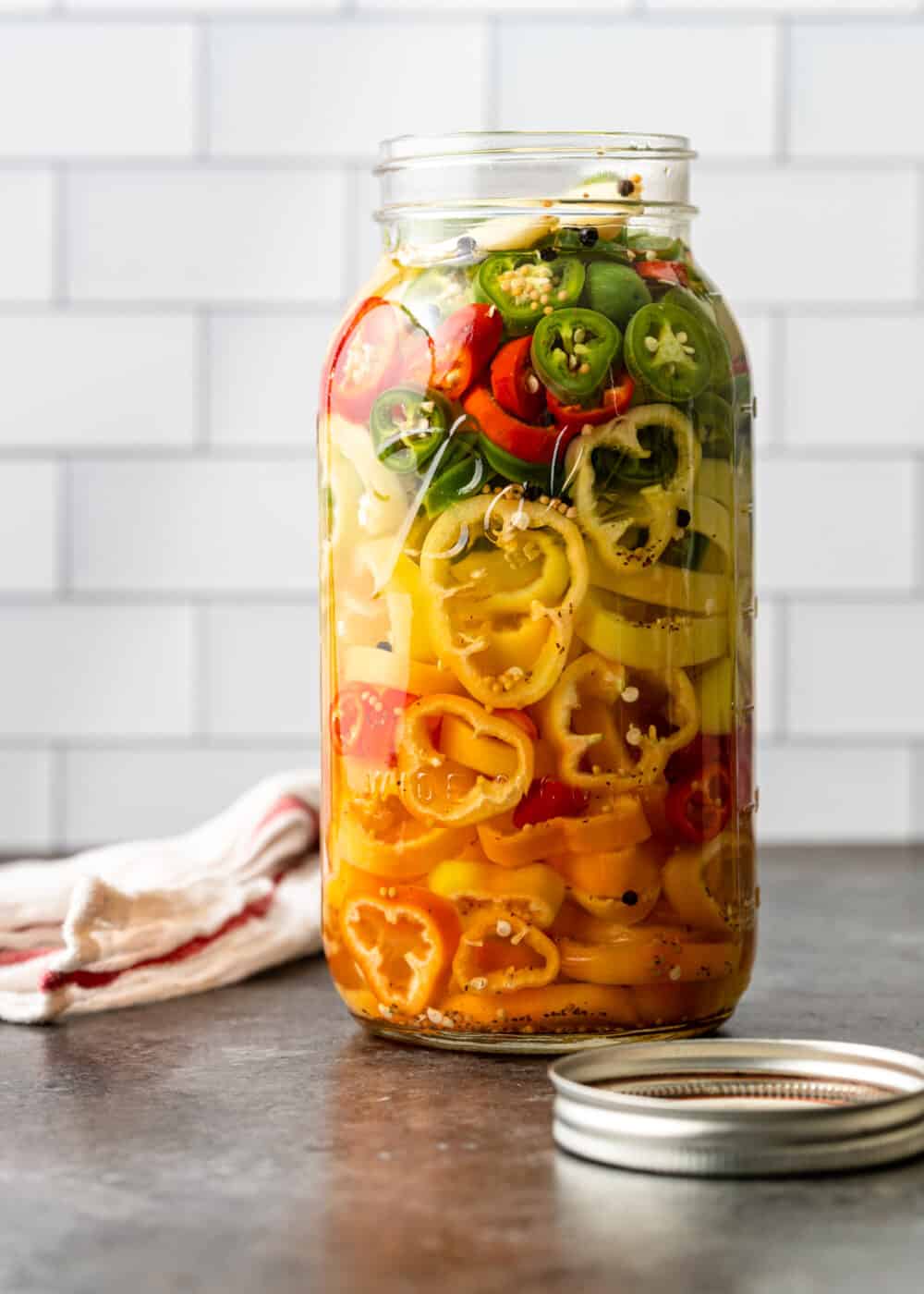 large glass jar of spicy refrigerator pickles