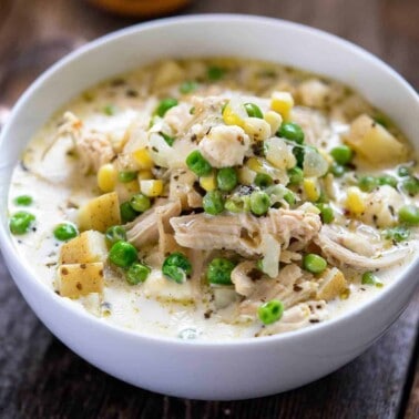 Locro de Papa creamy chicken and potato soup in white bowl